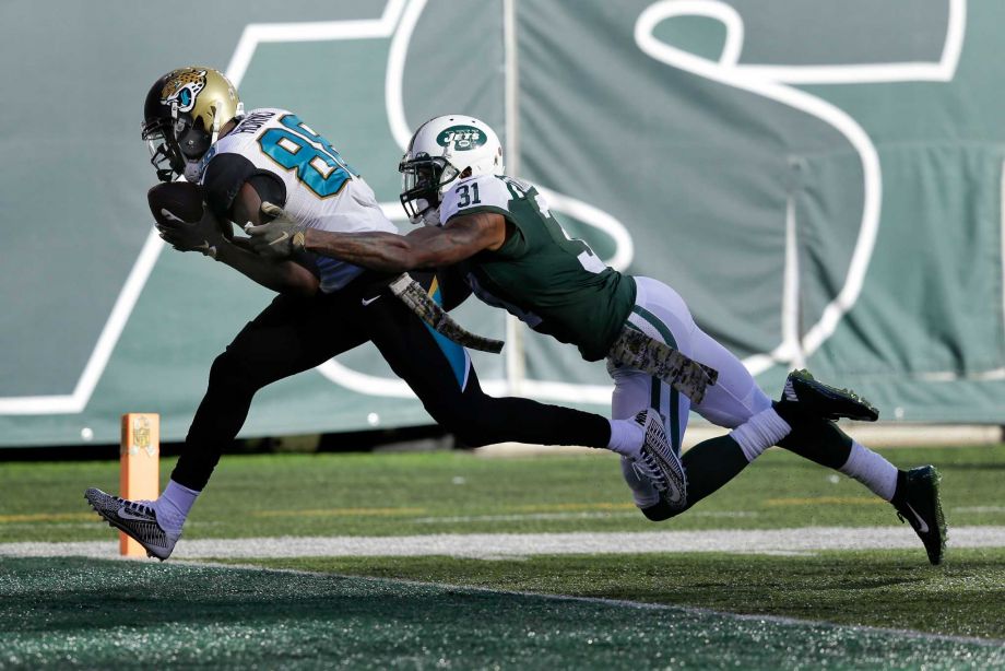 Jacksonville Jaguars wide receiver Allen Hurns crosses the goal line for a touchdown against New York Jets cornerback Antonio Cromartie during the second quarter of an NFL football game Sunday Nov. 8 2015 in East Rutherford N.J