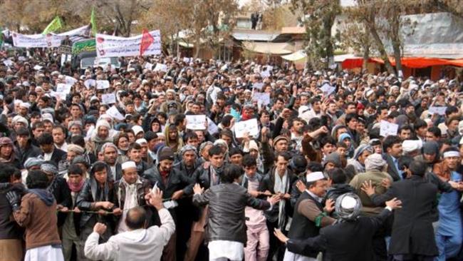 Afghan men protest to condemn the killing of Shia Muslims in Ghazni Province