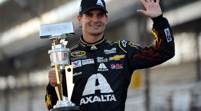 INDIANAPOLIS IN JULY 27 Jeff Gordon driver of the #24 Axalta Chevrolet celebrates with the trophy after winning the NASCAR Sprint Cup Series Crown Royal Presents The John Wayne Walding 400 at the Brickyard Indianapolis Motor Speedway