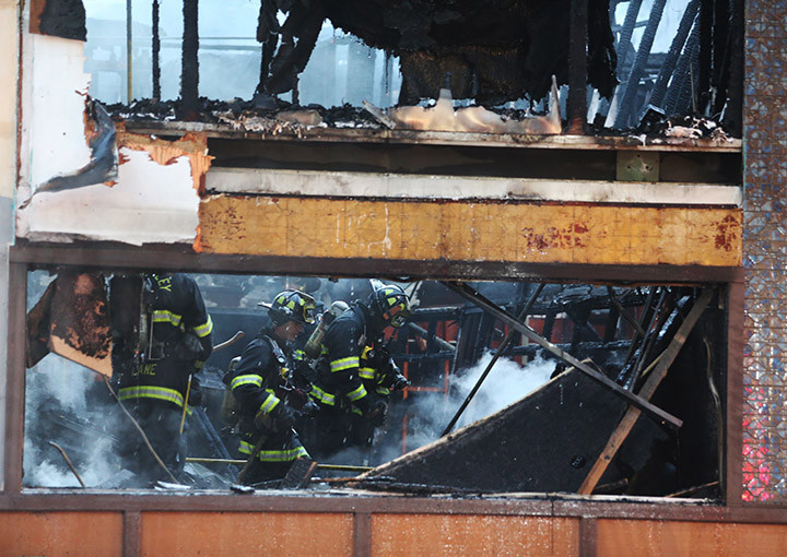 Firefighters fight hot spots at a fire at the Mandarin Garden restaurant in Berkeley on Friday Nov. 27 2015