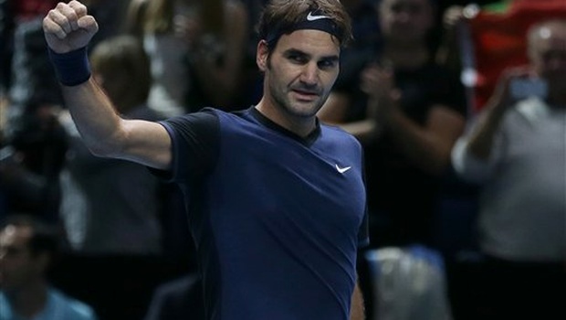 Switzerland's Roger Federer celebrates winning the match against Serbia's Novak Djokovic during their ATP World Tour Finals tennis match at the O2 Arena in London England.| AP