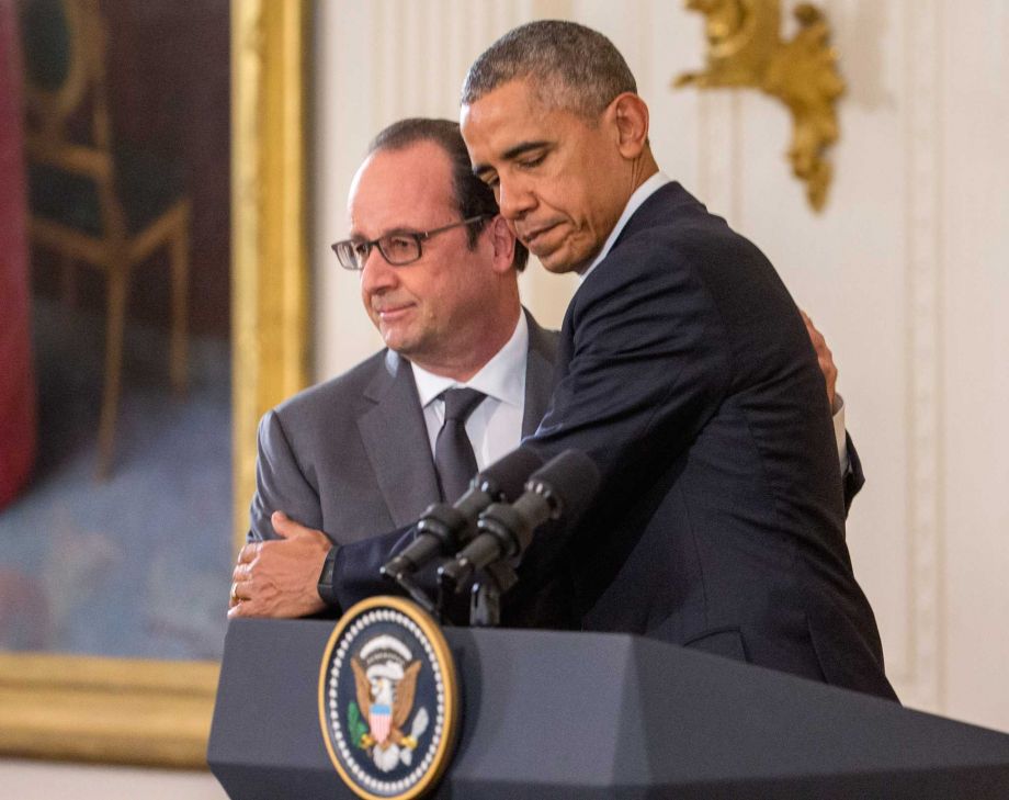 President Barack Obama and French President Francois Hollande embrace during a joint news conference in the East Room of the White House in Washington Tuesday Nov. 24 2015. Hollande's visit to Washington is part of a diplomatic offensive to get the int