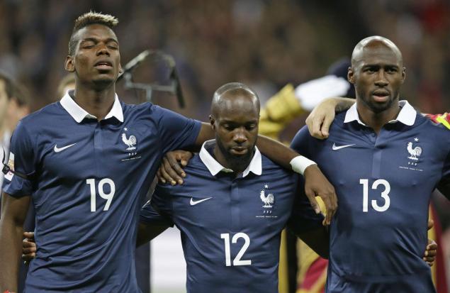 French players Paul Pogba Lassana Diarra and Eliaquim Mangala embrace as 'La Marseillaise&#39 plays prior to Tuesday's England France friendly match