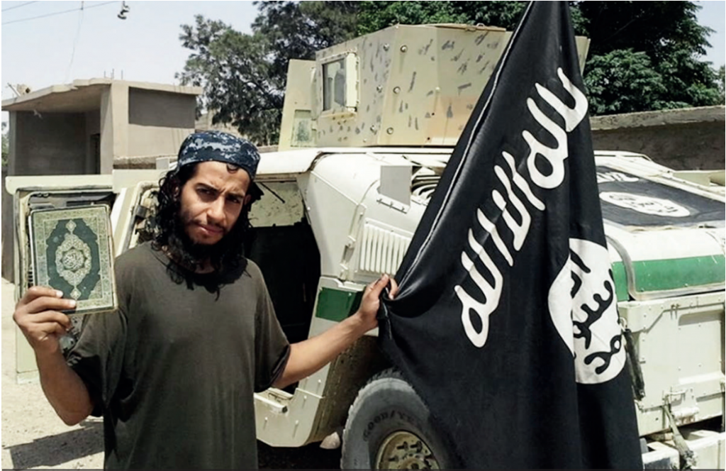 Abdelhamid Abaaoud the suspected mastermind of the Paris terror attacks on November 13 waves an Islamic State flag in this undated