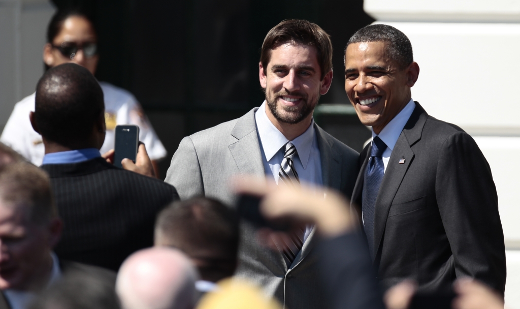 Aaron Rodgers left after honoring the Super Bowl XLV Champion Green Bay Packers Friday Aug. 12 2011 in a ceremony on the South Lawn of the White House in Washin