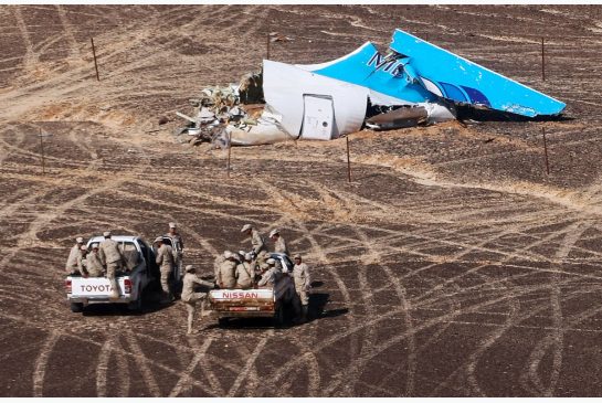 Egyptian Military cars approach the tail wreckage the Russian passenger jet the FSB says was downed by a homemade explosive device equivalent to 1kg of TNT on Oct. 31 2015