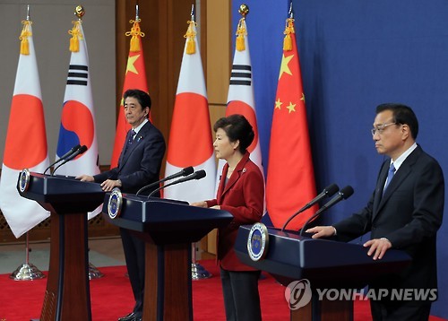 South Korean President Park Geun-hye holds a joint press conference with Japanese Prime Minister Shinzo Abe and Chinese Premier Li Keqiang after holding a trilateral summit at the presidential office Cheong Wa Dae in Seoul on Nov. 1 2015 The thr