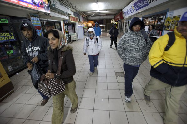 GREGORY BULL						Credit AP				People make their way toward the border to cross in Mexicali Mexico