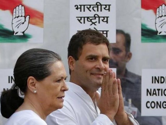 Congress party chief Sonia Gandhi and her son and vice-president of Congress Rahul Gandhi arrive to address a news conference in New Delhi