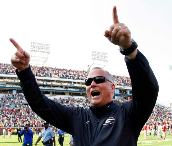 Georgia head coach Mark Richt celebrates as he walks off the field after his team defeated Georgia Tech 13-7 in an NCAA college football game in Atlanta Ga. Richt is stepping down after 15 seasons in what is bein