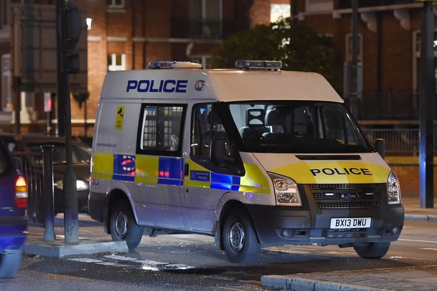 Police patrol the site where an abandoned vehicle caused a bomb scare near the Baker Street Underground station