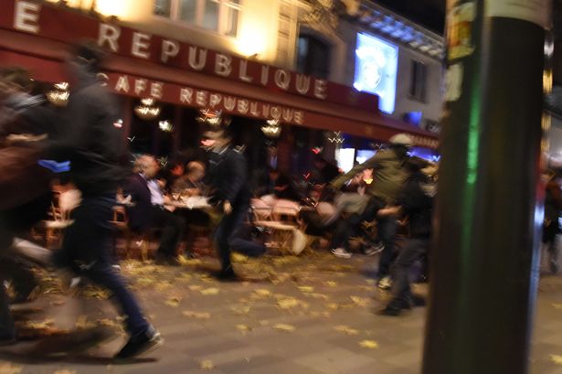 Getty

Panic People run after hearing what is believed to be explosions or gun shots near Place de la Republique square