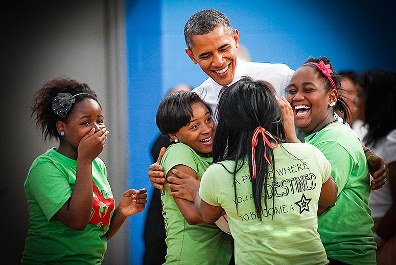 Girls hug President Barack Obama as he visits the Boys and Girls Club of Cleveland