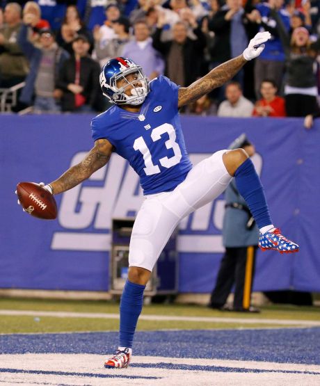 New York Giants wide receiver Odell Beckham celebrates after scoring a touchdown during the first half of an NFL football game against the New England Patriots Sunday Nov. 15 2015 in East Rutherford N.J