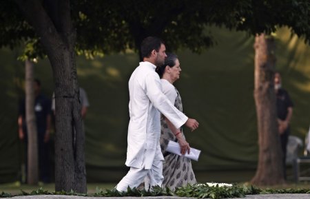 India's Congress party chief Sonia Gandhi walks along with her son and lawmaker Rahul Gandhi at her husband and former Indian Prime Minister Rajiv Gandhi's memorial on the occasion of his 23rd death anniversary in New Delhi