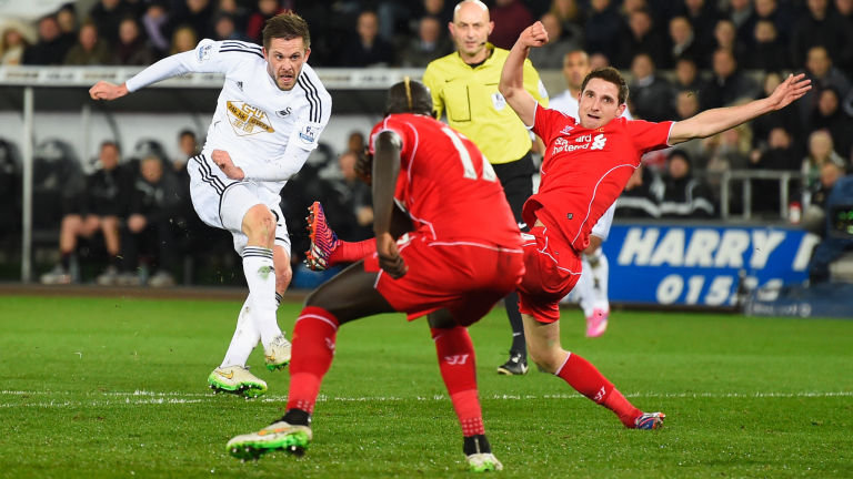 Gylfi Sigurdsson scores for Swansea against Liverpool in the Premier League last season