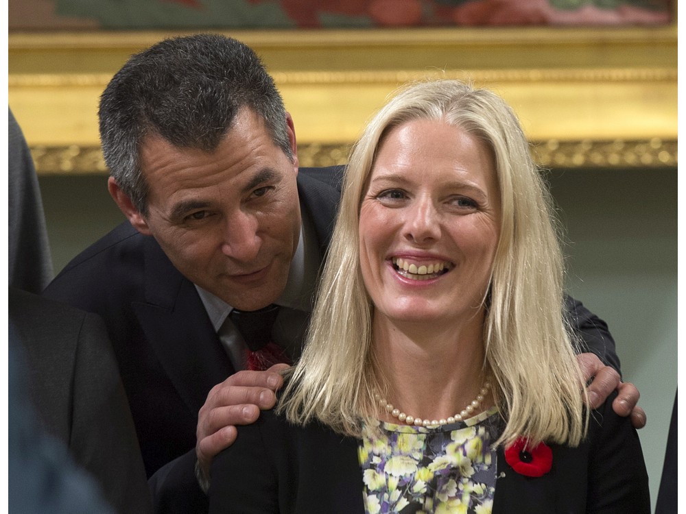 Hunter Tootoo Minister of Fisheries Oceans and the Canadian Coast Guard speaks with Catherine McKenna Minister of the Environment and Climate Change as they wait for a group