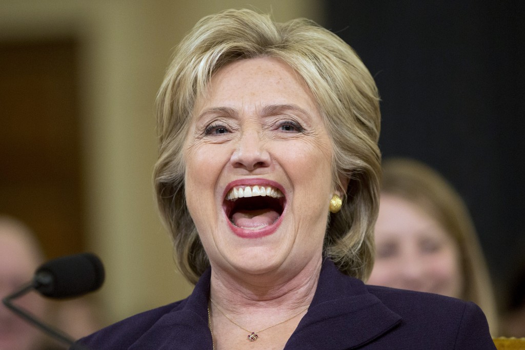 Democratic presidential candidate and former Secretary of State Hillary Rodham Clinton laughs out loud after Rep. Martha Roby R-Ala. asked Clinton if she was home alone during night of the 2012 Benghazi attacks during testimony on Capitol Hill in Washi