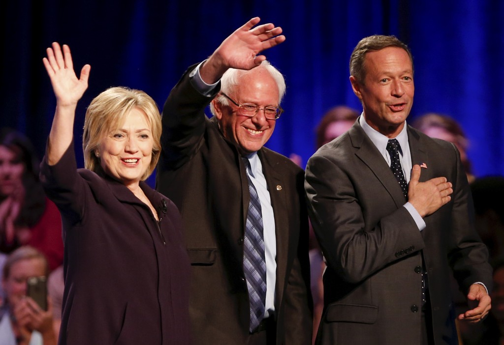 Democratic presidential candidates Hillary Clinton, Bernie Sanders and Martin O'Malley wave to the crowd following the First in the South Presidential Candidates Forum held at Winthrop University in Rock Hill South Carolina