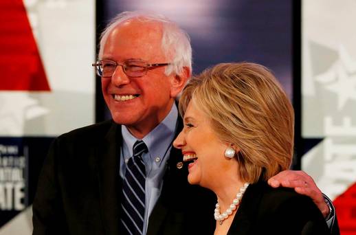 Hillary Clinton shares a laugh with fellow candidate Senator Bernie Sanders after the second Democratic debate in Des Moines Iowa