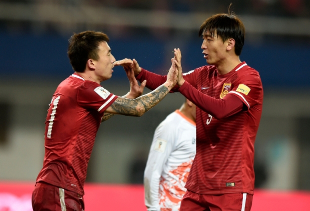 China and teammate Wang Yongpo celebrating during their 2018 FIFA World Cup qualifying match against Bhutan in Changsha in China’s Hunan province on Nov 12 2015. — AFP pic