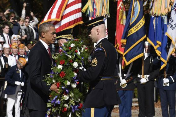 President Barack Obama lays a wreath at the Tomb of the Unknowns Wednesday Nov. 11 2015 at Arlington National Cemetery in Arlington Va. during Veterans Day ceremonies