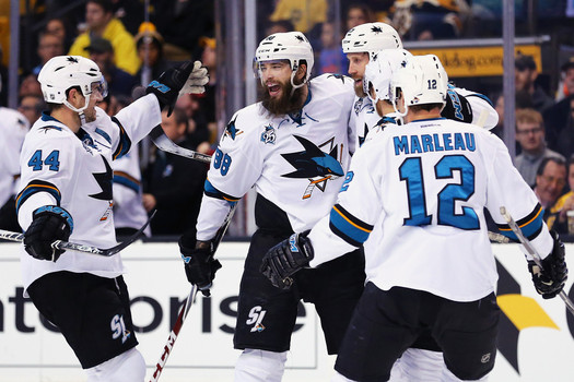 Joe Thornton #19 of the San Jose Sharks celebrates with Patrick Marleau #12 Brent Burns #88 and Joe Pavelski #8 after scoring a goal against the Boston Bruins during the second period at TD Garden