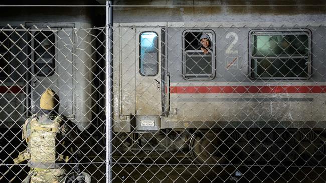 Refugees wait on a train after crossing the Slovenian Croatian border in Dobova