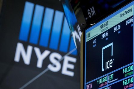 The ticker for Intercontinental Exchange Inc. is displayed on a screen over the post where it is traded on the floor of the New York Stock Exchange