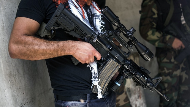 Man with machine gun West Bank