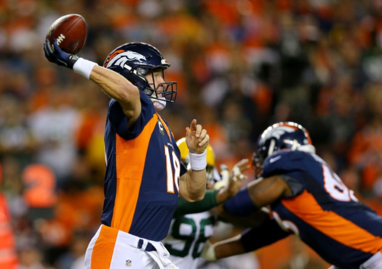 Getty Images  AFP  File  Justin Edmonds Peyton Manning of the Denver Broncos throws for a first down in the first quarter against the Green Bay Packers at Sports Authority Field at Mile High