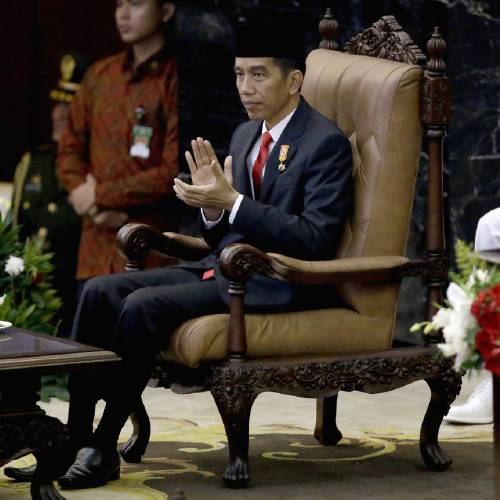 Indonesian President Joko'Jokowi Widodo applauds prior to speaking before Parliament members ahead of the country's Independence Day in Jakarta Indonesia. Widodo makes his first White House visit Oc