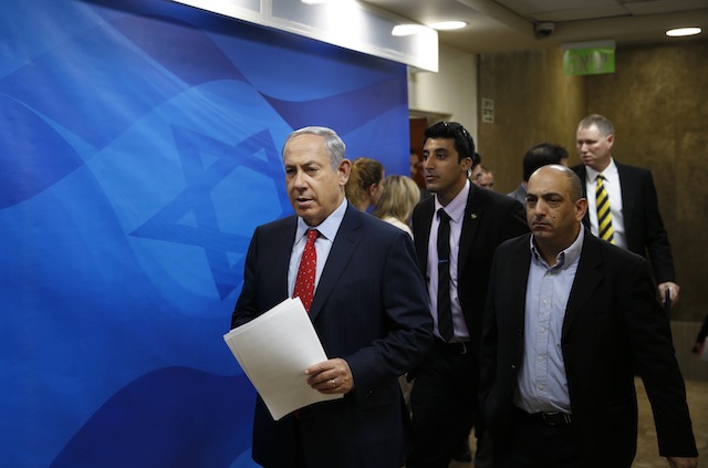 Israel's Prime Minister Benjamin Netanyahu left arrives for the weekly cabinet meeting in Jerusalem Sunday Nov. 15 2015