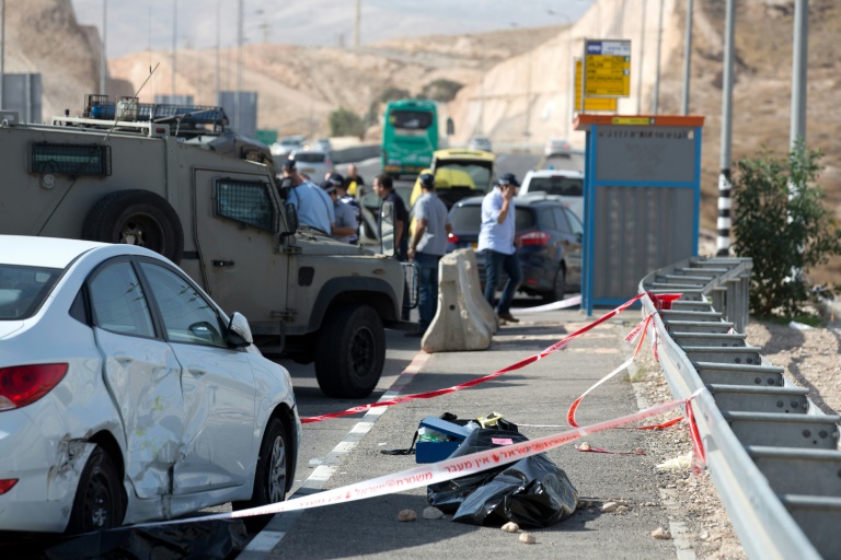 AFP  Menahem Kahana The covered body of a Palestinian driver who attempted to ram into civilians and charged at them with a knife before being shot dead is seen on a highway next the Jewish settlement of Kfar Adumim