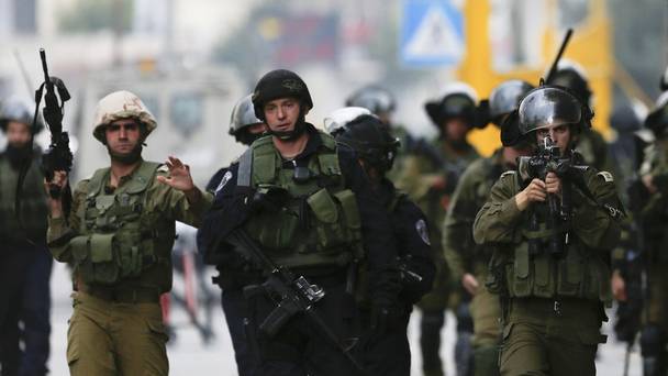 Israeli security forces shot dead a Palestinian man who drove his car into a group of Israelis