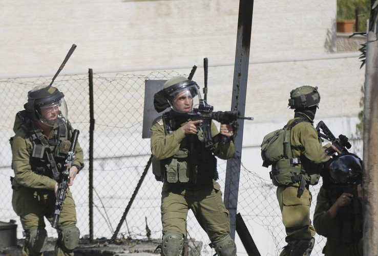 Israeli troops clash with Palestinian demonstrators in Hebron on 30 October