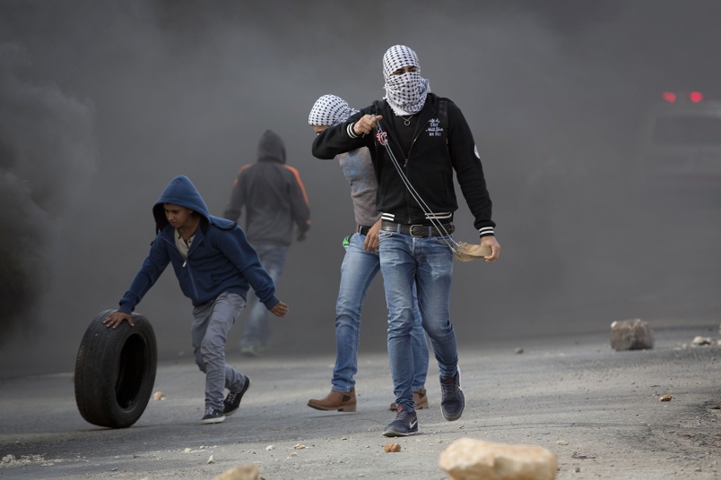 An injured woman being transferred to a hospital after a Palestinian man attacked passengers on a bus in Jerusalem Oct. 12 2015