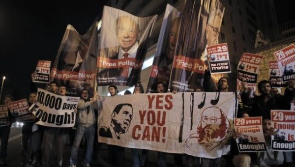 Israelis hold placards during a protest calling for the release of Jonathan Pollard from a U.S. prison in Jerusalem Jan. 2 2014