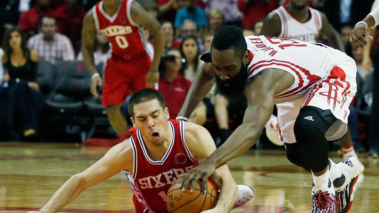 James Harden #13 of the Houston Rockets battles for the basketball with T.J. Mc Connell of the Philadelphia 76ers