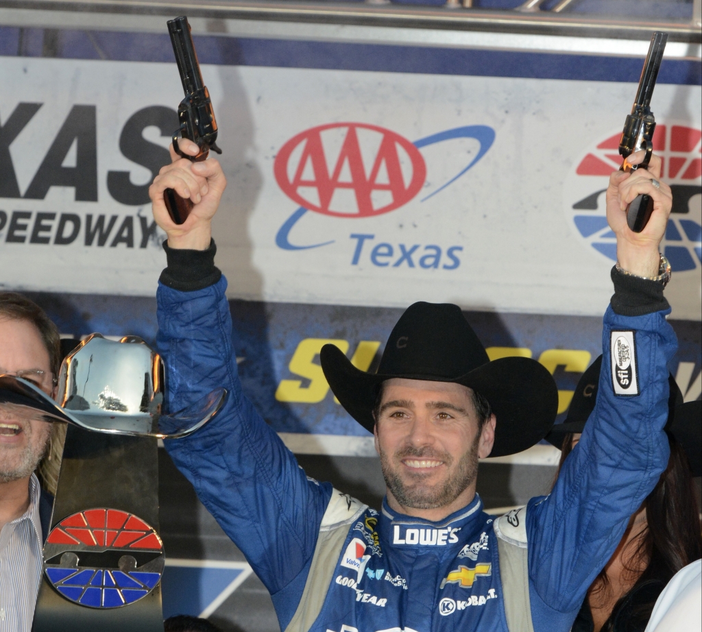 Jimmie Johnson fires pistols in victory lane after winning the NASCAR Sprint Cup Series auto race at Texas Motor Speedway in Fort Worth Texas Sunday Nov. 8 2015