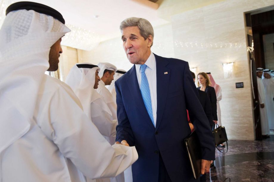 U.S. Secretary of State John Kerry greets staff of Abu Dhabi Crown Prince Mohammed bin Zayed Al Nahyan before their meeting at Mina Palace in Abu Dhabi United Arab Emirates on Monday Nov. 23 2015