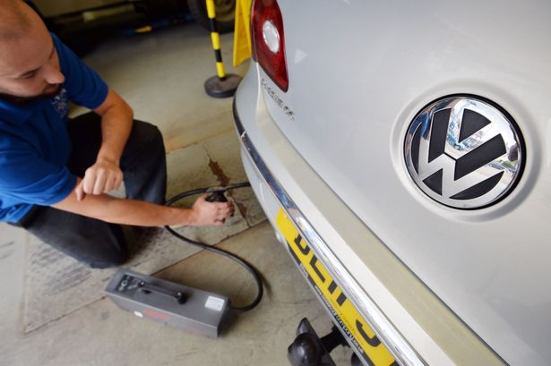 A Volkswagen Passat CC car being tested for its exhaust emissions