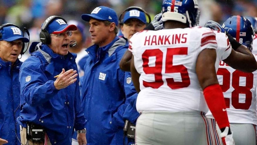 SEATTLE WA- NOVEMBER 09 Head coach Tom Coughlin of the New York Giants yells at defensive tackle Johnathan Hankins #95 of the New York Giants as he comes off the field during the first quarter of the game against the Seattle Seahawks at Century Link Fie