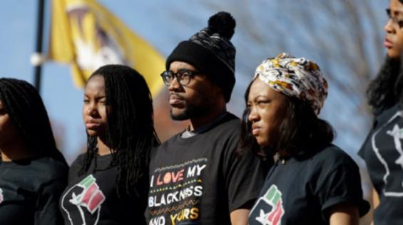 Jonathan Butler center with supporters at the University of Missouri