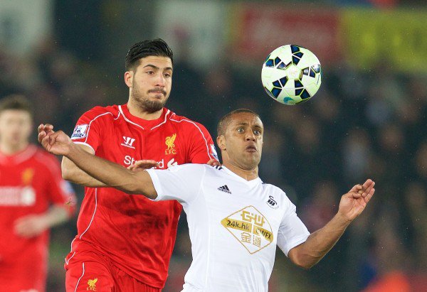 Liverpool's Emre Can in action against Swansea City's Wayne Routledge during the Premier League match at the Liberty Stadium