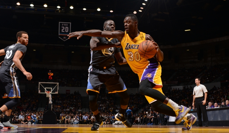 Julius Randle drives against Golden State in the preseason on Oct. 17. 
  
   

   Lakers Prep for Undefeated Warriors