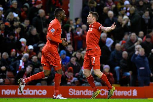 Liverpool's James Milner celebrates scoring his sides first goal of the game during the Barclays Premier League match at Anfield Liverpool. Martin Rickett  PA Wire