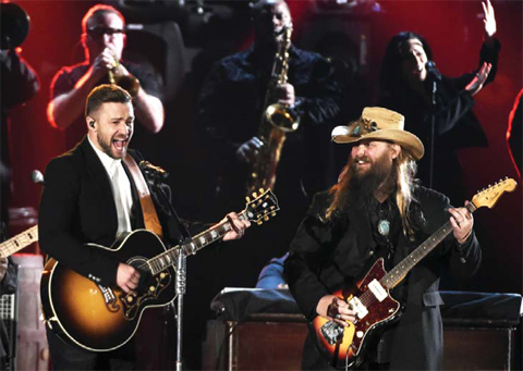 Justin Timberlake and Chris Stapleton perform Wednesday during the 49th annual CMA Awards at the Bridgestone Arena in Nashville Tenn