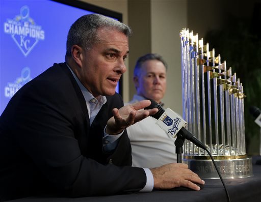 Kansas City Royals general manager Dayton Moore left and manager Ned Yost speak to members of the media with their World Series trophy during a news conference wrapping up the team's season Thursday Nov. 5 2015 in Kansas City Mo. The Royals capped