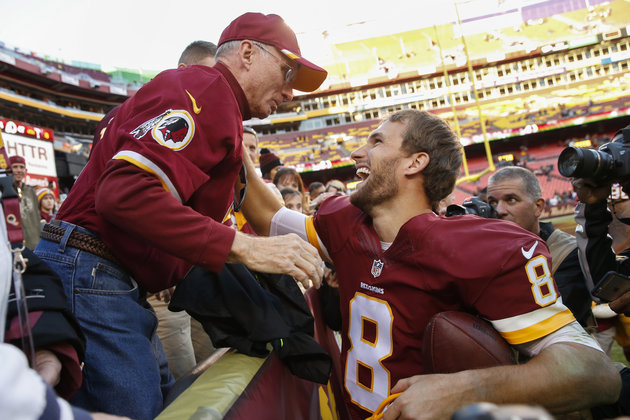 Washington Redskins quarterback Kirk Cousins greets his father Don Cousins after his game against the New Orleans Saints on Sunday. Washington defeated New Orleans 47-14